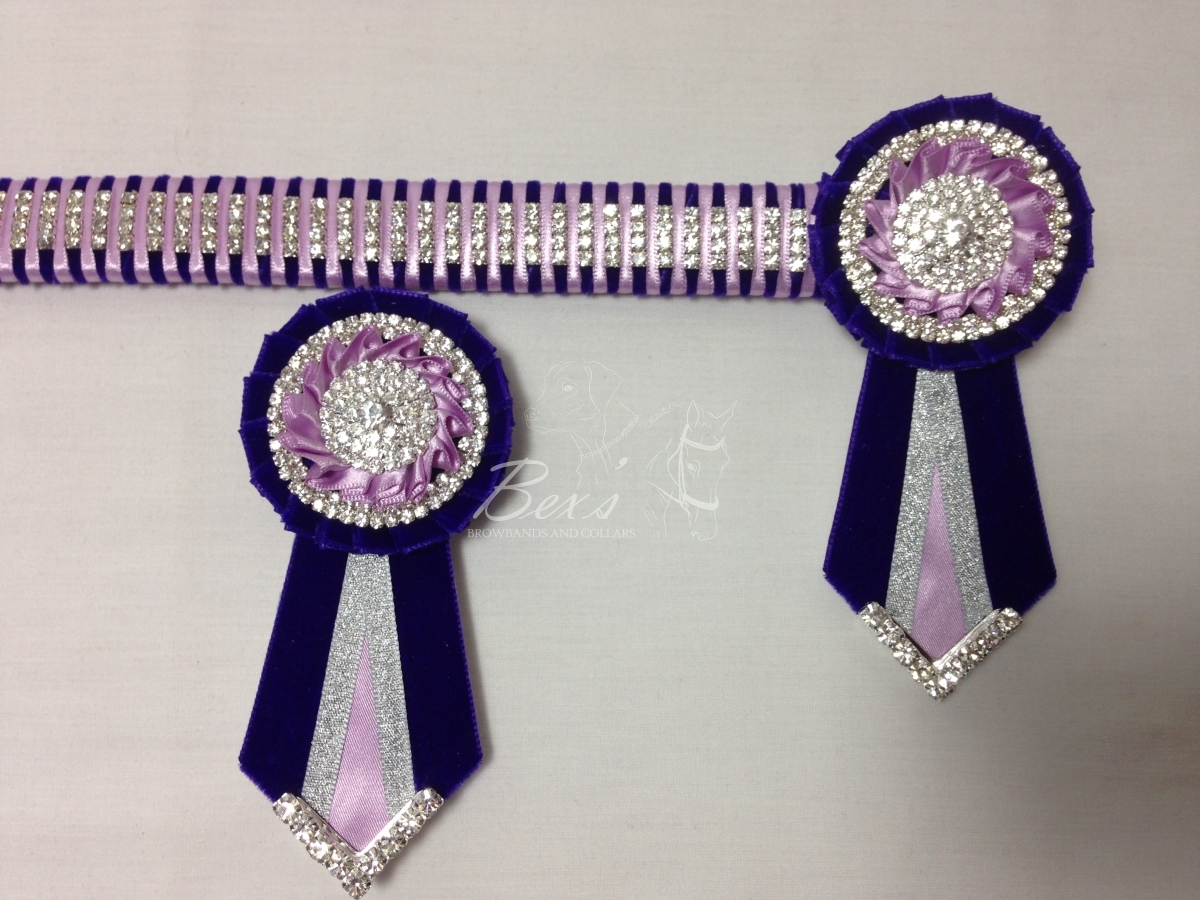 1" Crystal Show Browband: Purple velvet background, 4 rows of Silver crystal chain woven on with Light Orchid satin. Pleated rosettes with plain Silver double row crystal rings and centres. V shaped tails with Silver crystal flag tips. Shown here with removable rosettes.